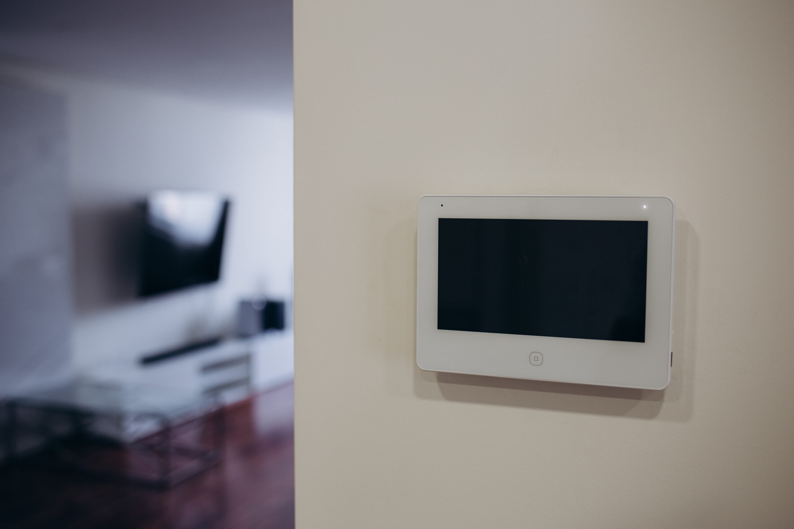 smart screen with smart home apps on wall in modern living room