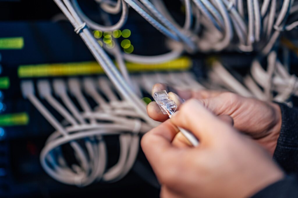 technician holding ethernet cable setting up the 2023 11 27 05 35 00 utc 2048x1366
