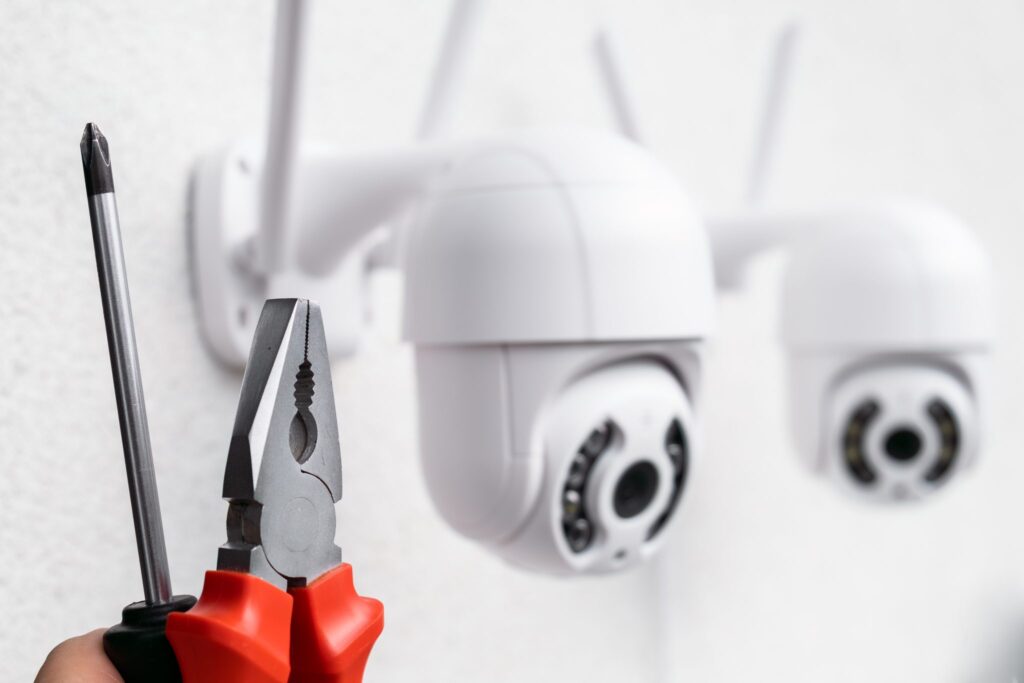 technician installing cctv camera using pliers and 2023 11 27 05 06 57 utc 2048x1365